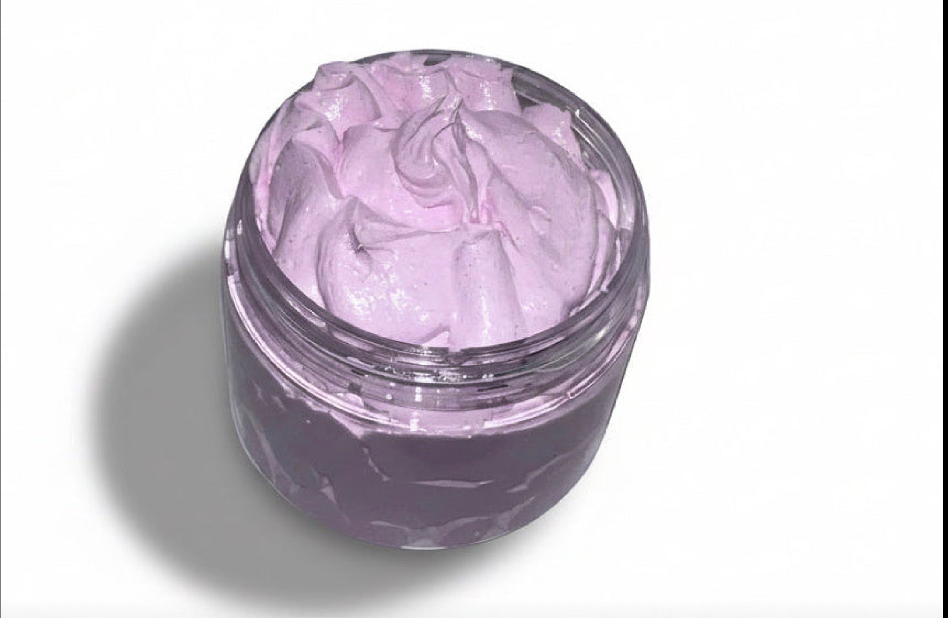 Plastic jar of pink body scrub  on a white background