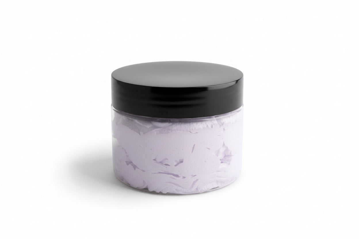 Clear container with purple body scrub with black lid on a white background