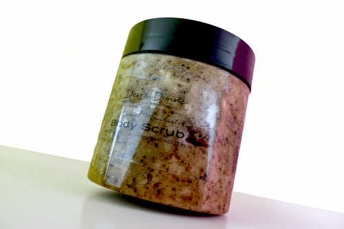 A plastic jar container coffee body scrub with a black lid on a white background tilted.